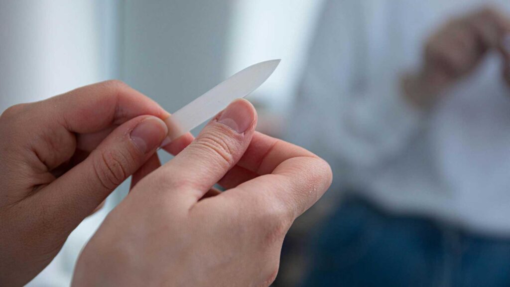 Masculine Man Filing Nail