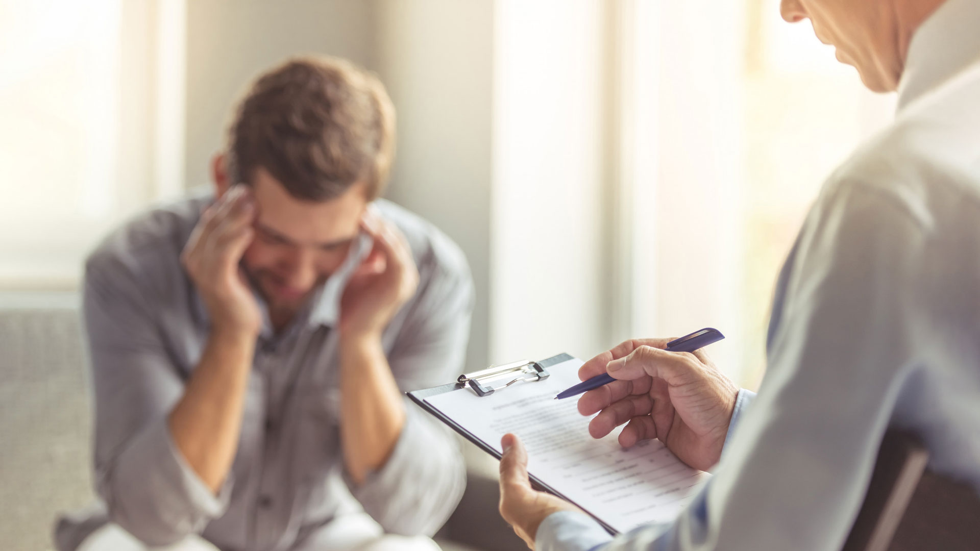 A person getting treatment from a therapist for losing his mind.